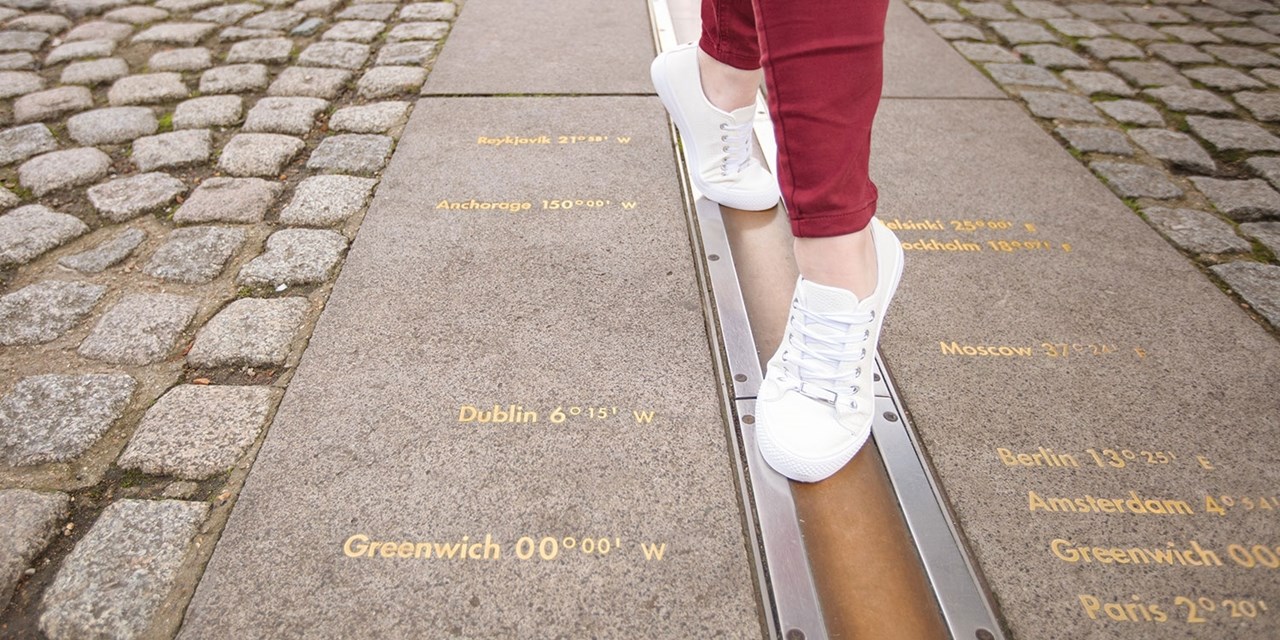 Stand in two hemispheres on the Prime Meridian