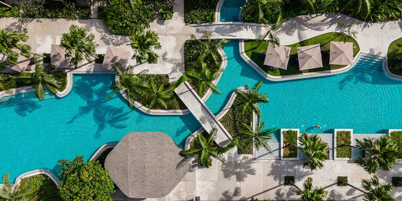 Float under the sun in the sprawling freeform pool