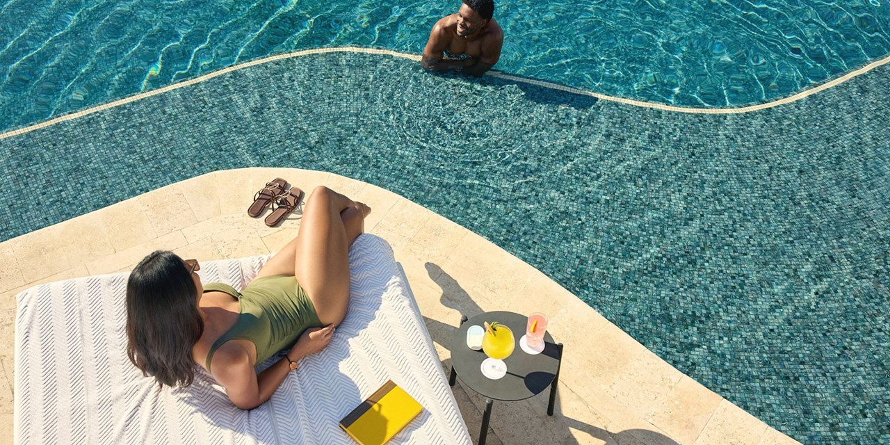 A couple by the pool