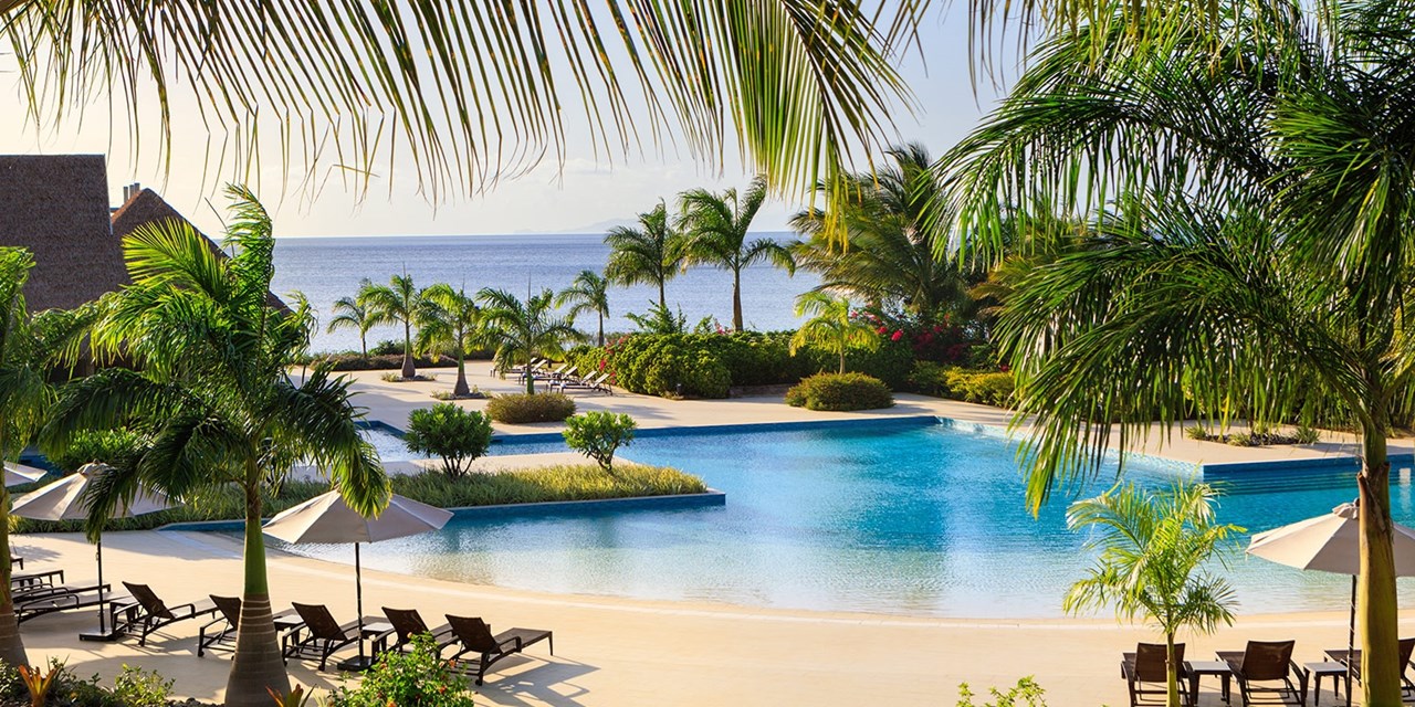 This upscale resort is nestled between rainforest and the Caribbean Sea
