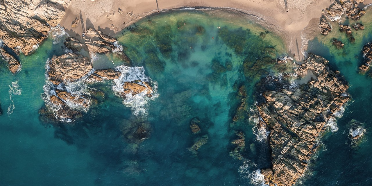 Waves break against rocky outcrops along Riviera Nayarit's coast