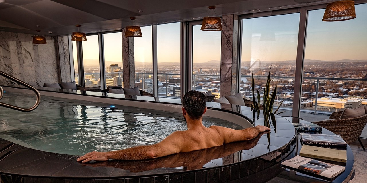 The heated pool is open year-round with views of the Laurentians from the ninth floor