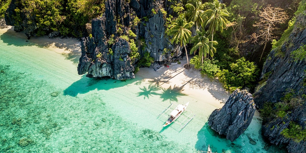 Entalula Beach in El Nido is known for its turquoise waters and massive cliffs
