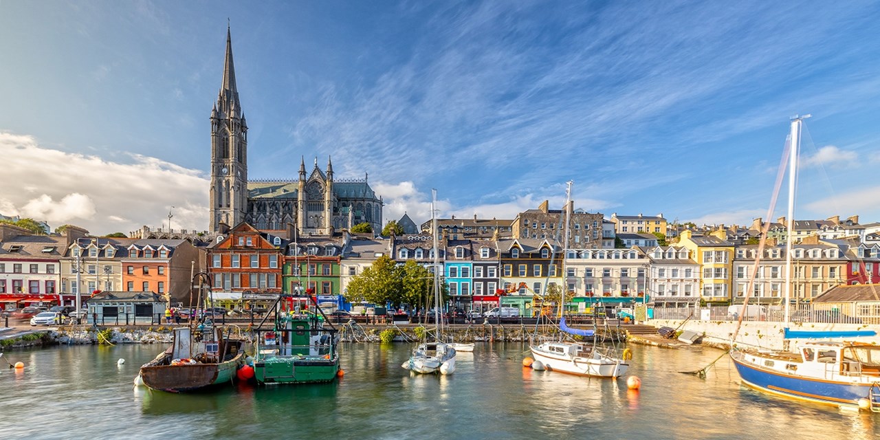 See colourful houses and church spires as you come into port