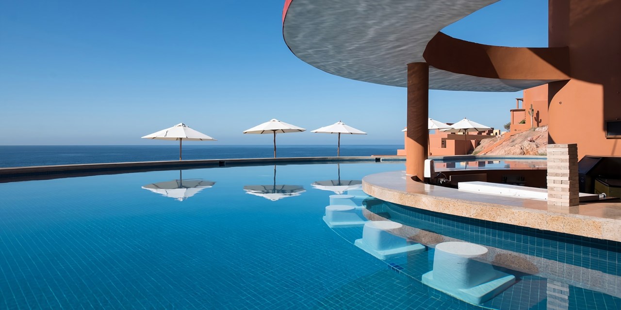 Order a drink from the swim-up bar