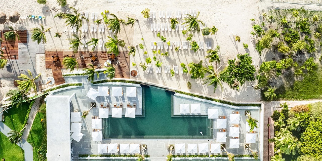 Spend the day between the pool and beach at Hotel Mousai Cancun