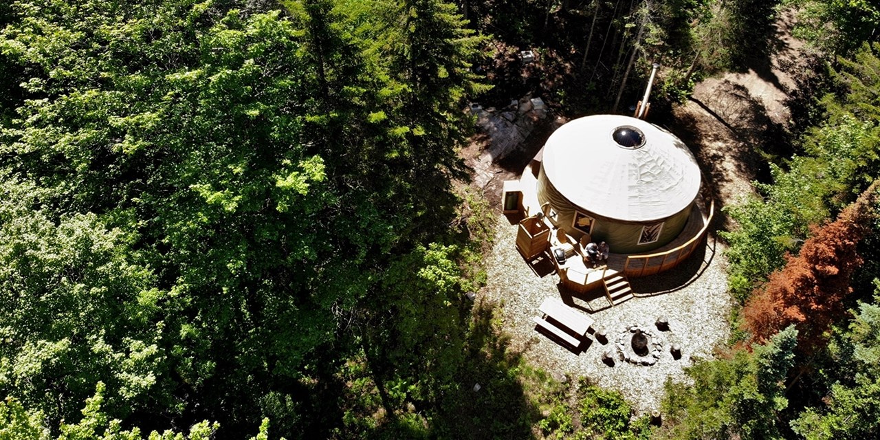 Glamping yurts have dining tables, couches, beds and more for a comfortable stay
