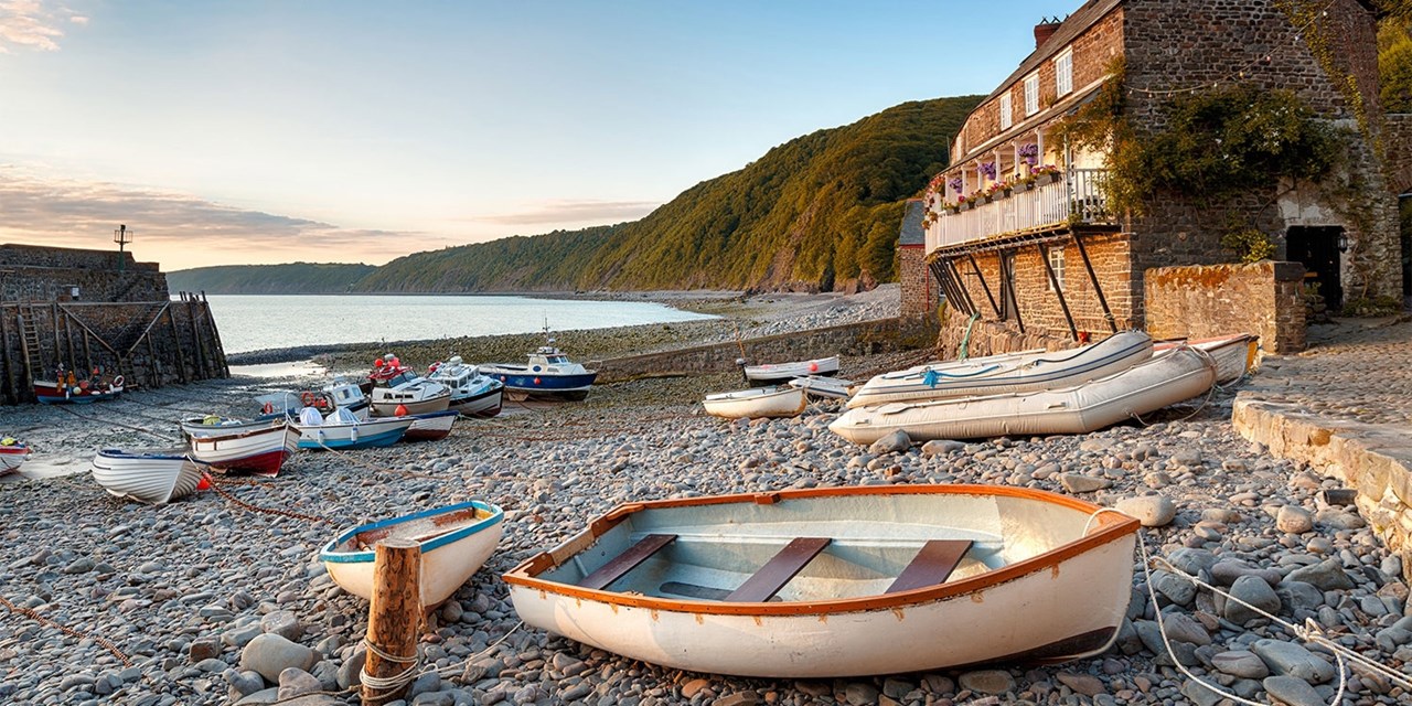 Cobbled lanes, whitewashed cottages, and fishing boats lend Clovelly a 'quaint, yesteryear feel' (BBC Travel)