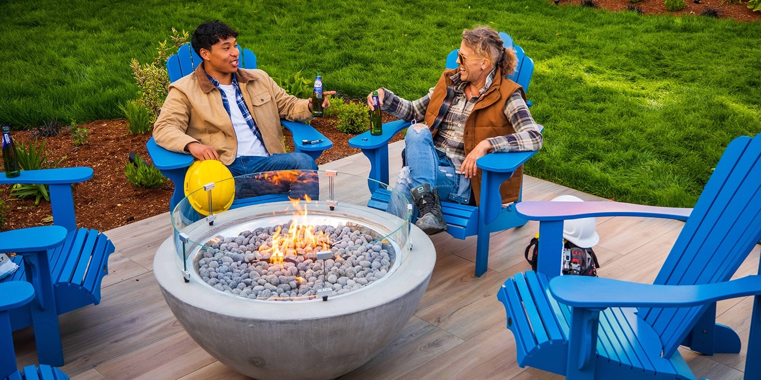 Enjoy a drink by the firepit in the Backyard