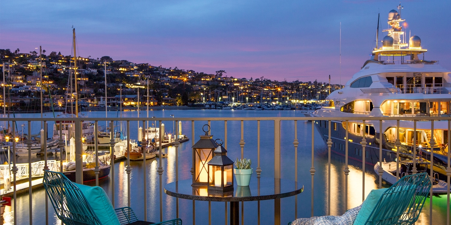 Relax and watch the boats sail by the marina