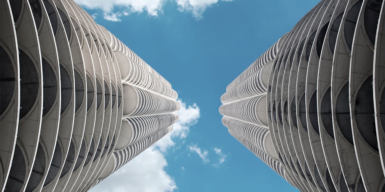 Marina City consists of twin 65-story, 587-foot cylindrical concrete towers that were completed in 1964