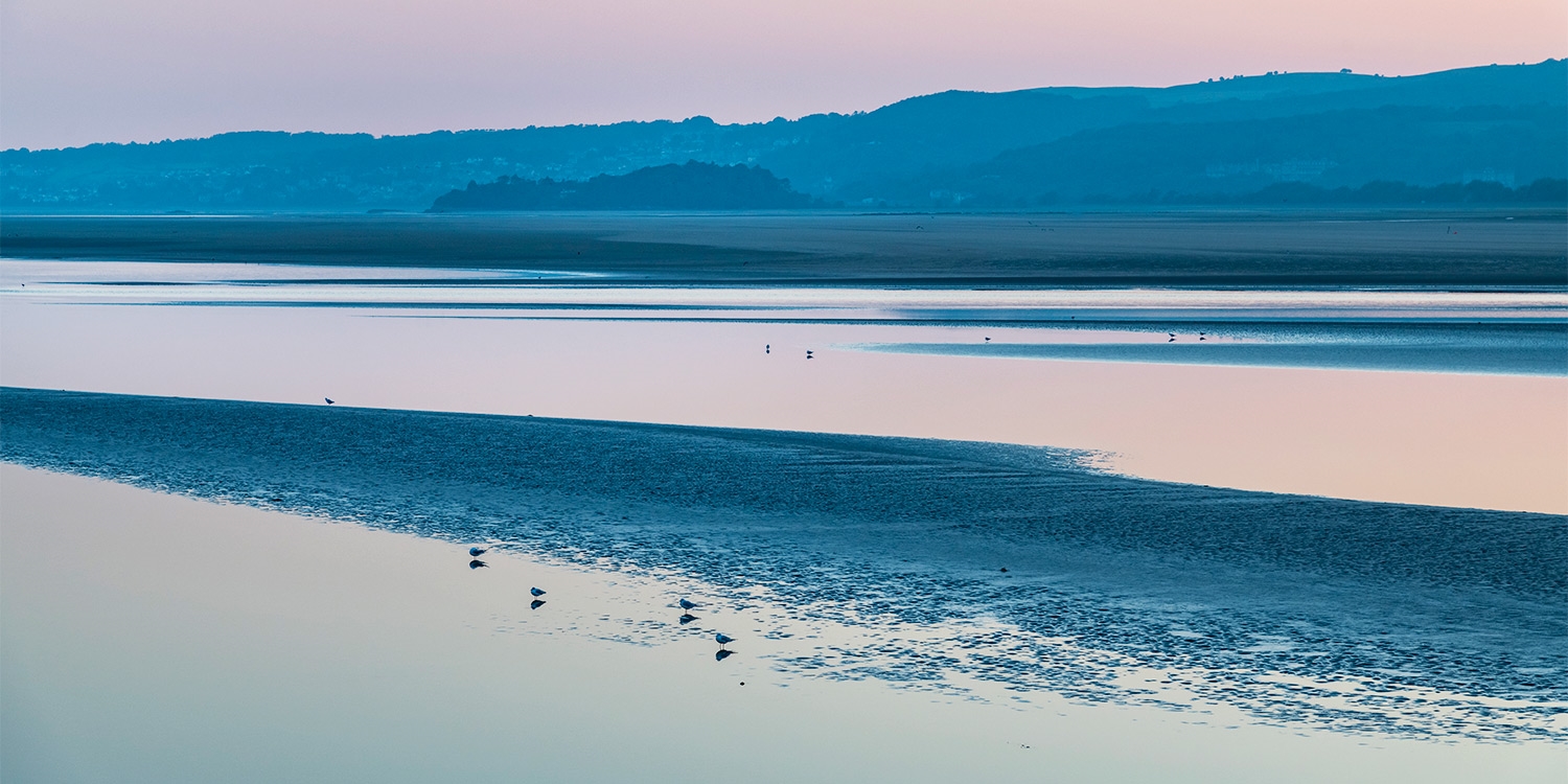 In Grange-over-Sands, a long promenade runs alongside a wide expanse of saltmarsh