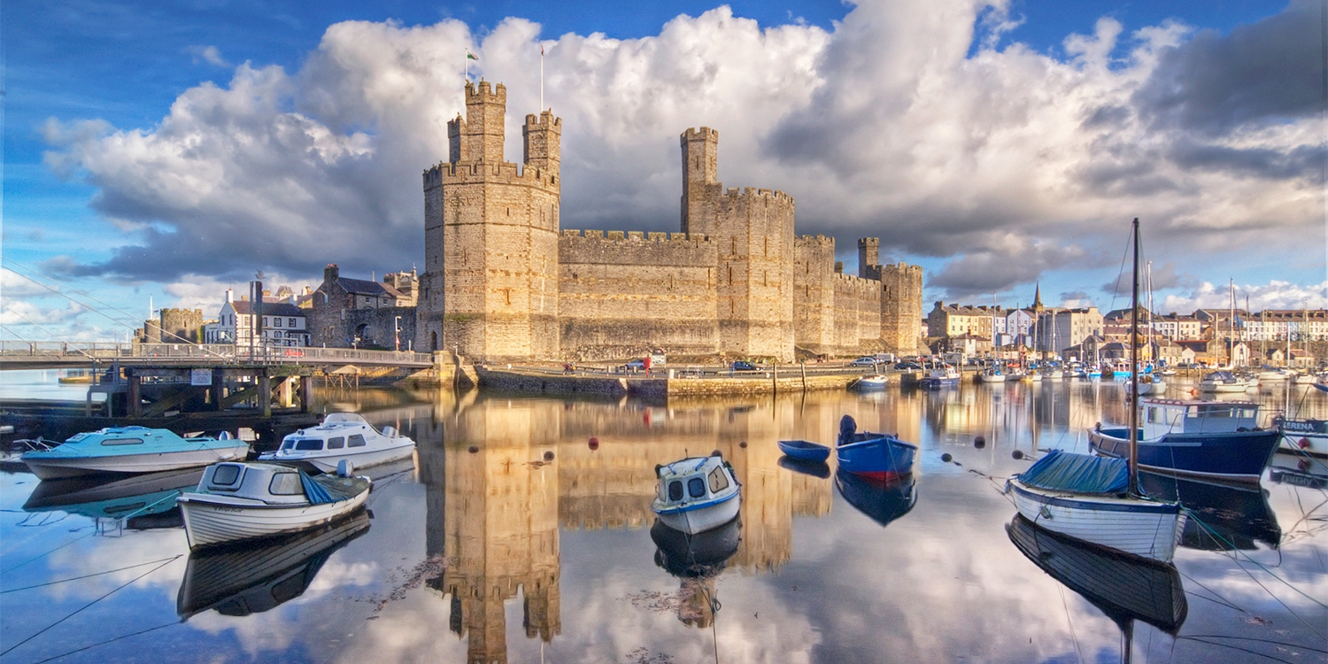 Famous for its castle, Caernarfon is a royal town with views across the Menai Strait to Anglesey