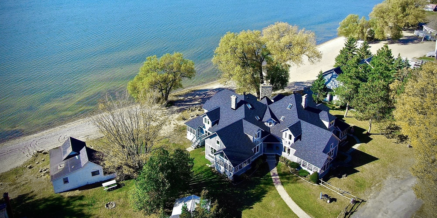 This charming waterfront retreat is adjacent to the Sandbanks